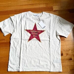 Cream Graphic Tee with Red Star and Gold Text
